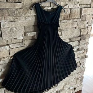Lanvin Iaturra black pleated sleeveless dress.